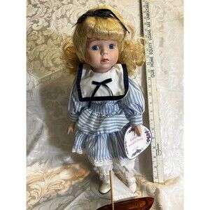 Keepsake porcelain Doll with stand. Carly